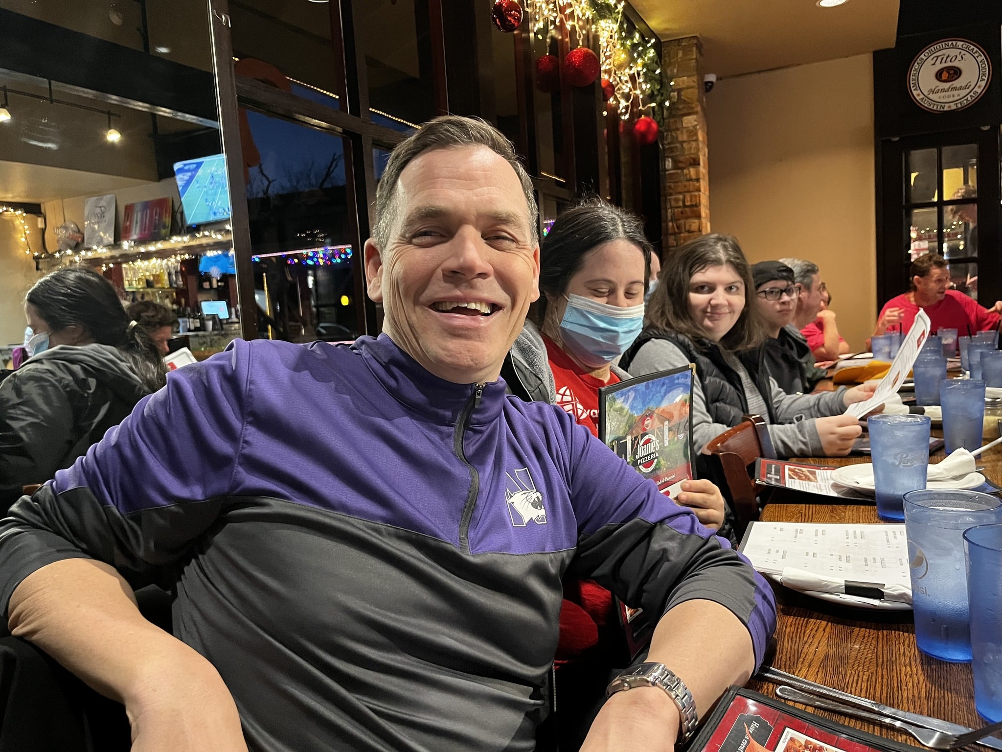 CEL member jay smiling at restaurant during excursion.